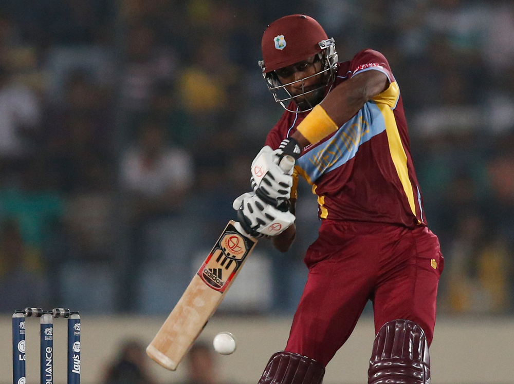 West Indies' batsman Dwayne Bravo plays a shot during their ICC Twenty20 Cricket World Cup semifinal match against Sri Lanka in Dhaka, Bangladesh, Thursday, April 3, 2014. (AP Photo/Aijaz Rahi)