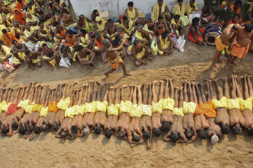 Devotees lie on the ground as they perform a ritual during the 'Danda' festival at Hariguda village in Odisha, Reuters photo