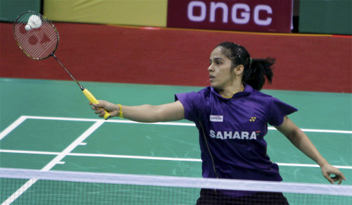 India's Saina Nehwal plays a shot during Women's singles match against Natcha Saengchote of Thailand at the Yonex Sunrise India open 2014 Badminton tournament in New Delhi on Thursday. PTI Photo