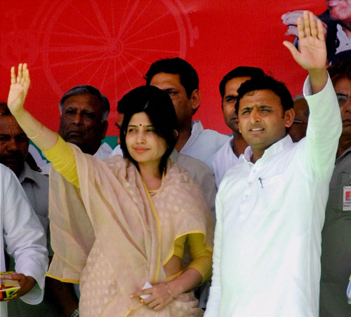 Chief Minister of Uttar Pradesh Akhilesh Yadav along with his wife and SP candidate Dimple Yadav during an election campaign rally after the latter filed her nomination papers in Kannauj on Thursday. PTI Photo 