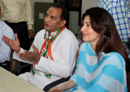 Congress candidate Mohammad Azharuddin, with Sangeeta Bijlani, filing his nomination papers in Tonk, Rajasthan on Thursday. PTI Photo