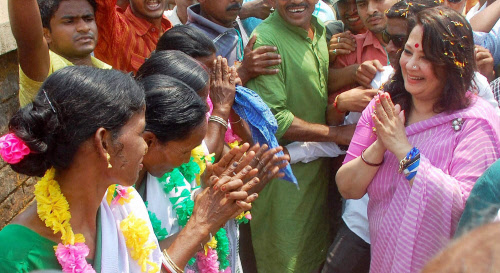 Actress and TMC candidate Moonmoon Sen greets tribal women at the party workers' convention in Bankura district in West Bengal on Thursday. PTI Photo