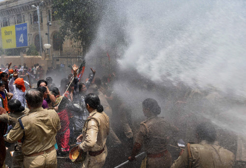 Lucknow: Water cannon being used to disperse BJP Mahila Morcha workers protesting against the Baduan rape case in Lucknow on Monday. PTI Photo by Nand Kumar