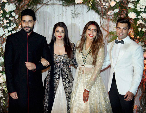 Actors Aishwarya Rai and Abhishek Bachchan poses with newly wed couple Bipasha Basu and Karan Singh Grover in Mumbai on Saturday. PTI Photo