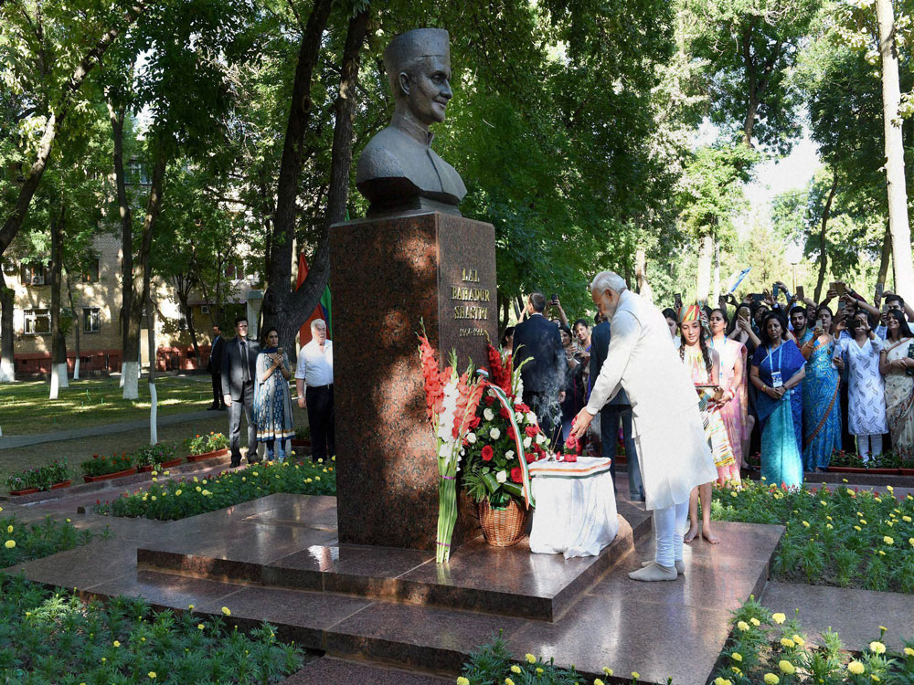 Prime Minister Narendra Modi paying floral tributes at the bust of former Prime Minister Lal Bahadur Shastri at Shastri street in Tashkent on Friday. PTI Photo