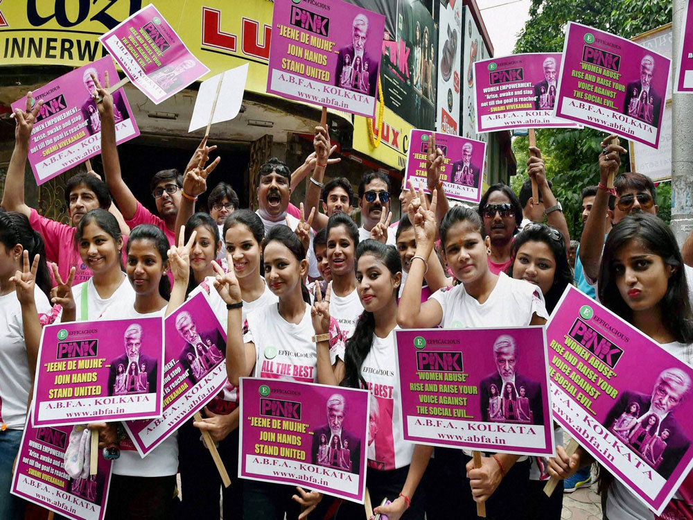 Amitabh Bachchan's fans show victory signs for the success his new film 'Pink', in Kolkata on Friday. PTI Photo