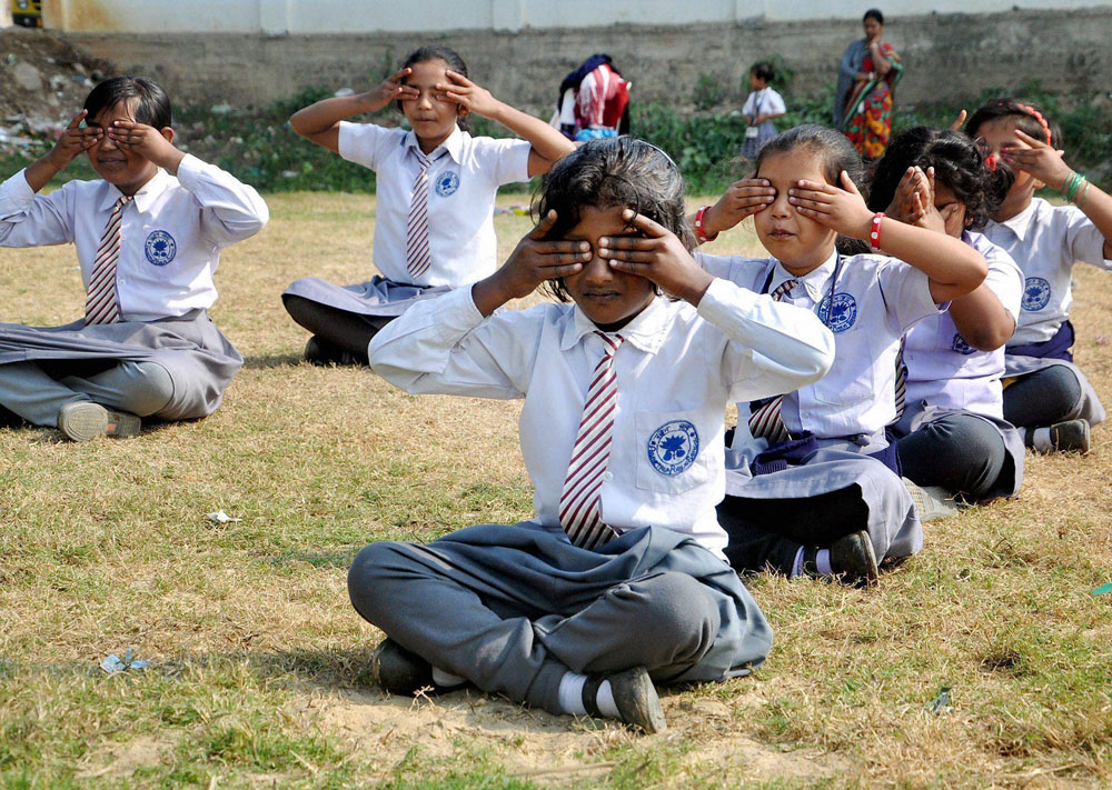 Students practice Yoga at a school in Agartala on Thursday as Yoga has been made compulsory in Tripura schools. PTI Photo