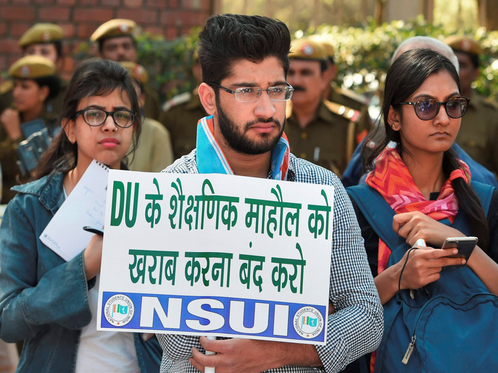  NSUI activists participating in peace unity march at Delhi University in New Delhi on Thursday. ABVP members on Wednesday clashed with AISA students at the North Campus of DU. PTI