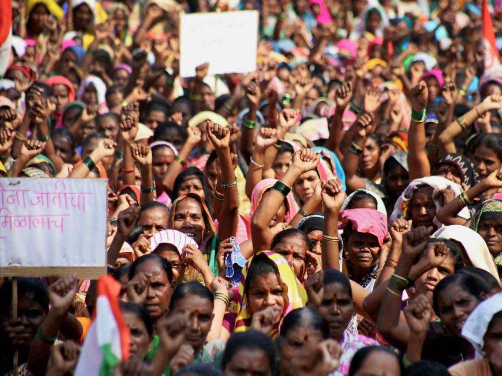 Shramjivi Sanghatana activists stage a massive protest against the cancellation of 46,000 ration cards by the government near collector's office in Thane, Mumbai on Wednesday.