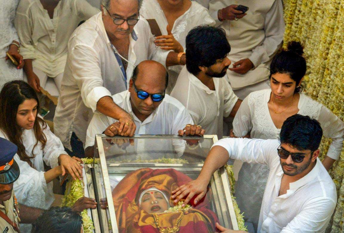 Boney Kapoor with his daughter Khushi seen on the truck carrying mortal remains of Bollywood actress Sridevi during the funeral procession in Mumbai on Wednesday. PTI Photo