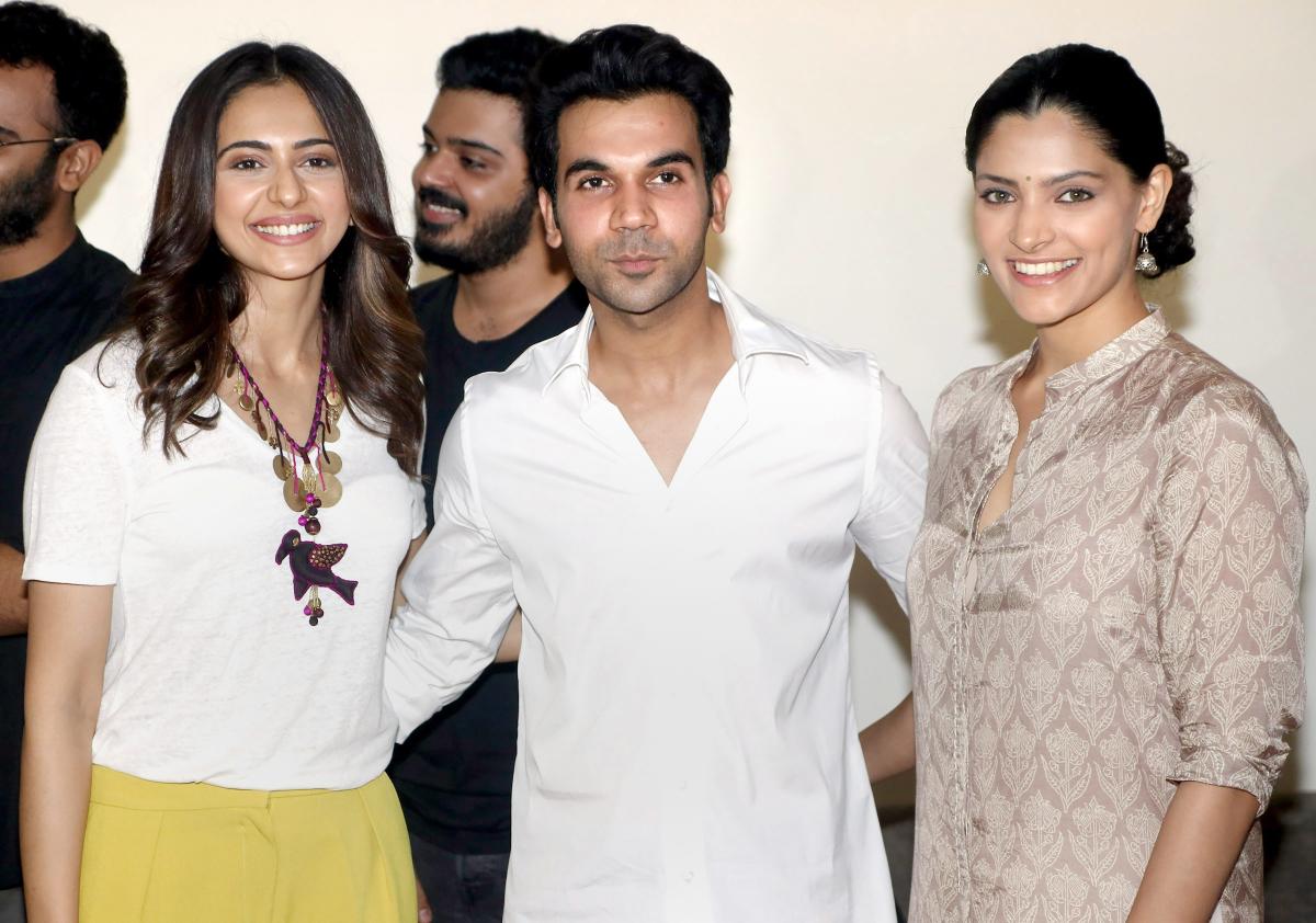 Bollywood actor Rajkummar Rao (C) with Rakul Preet Singh (L) and Saiyami Kher (R) pose for a photographer during the screening of his upcoming biographical crime drama 'Omerta' in Mumbai on Sunday. PTI Photo
