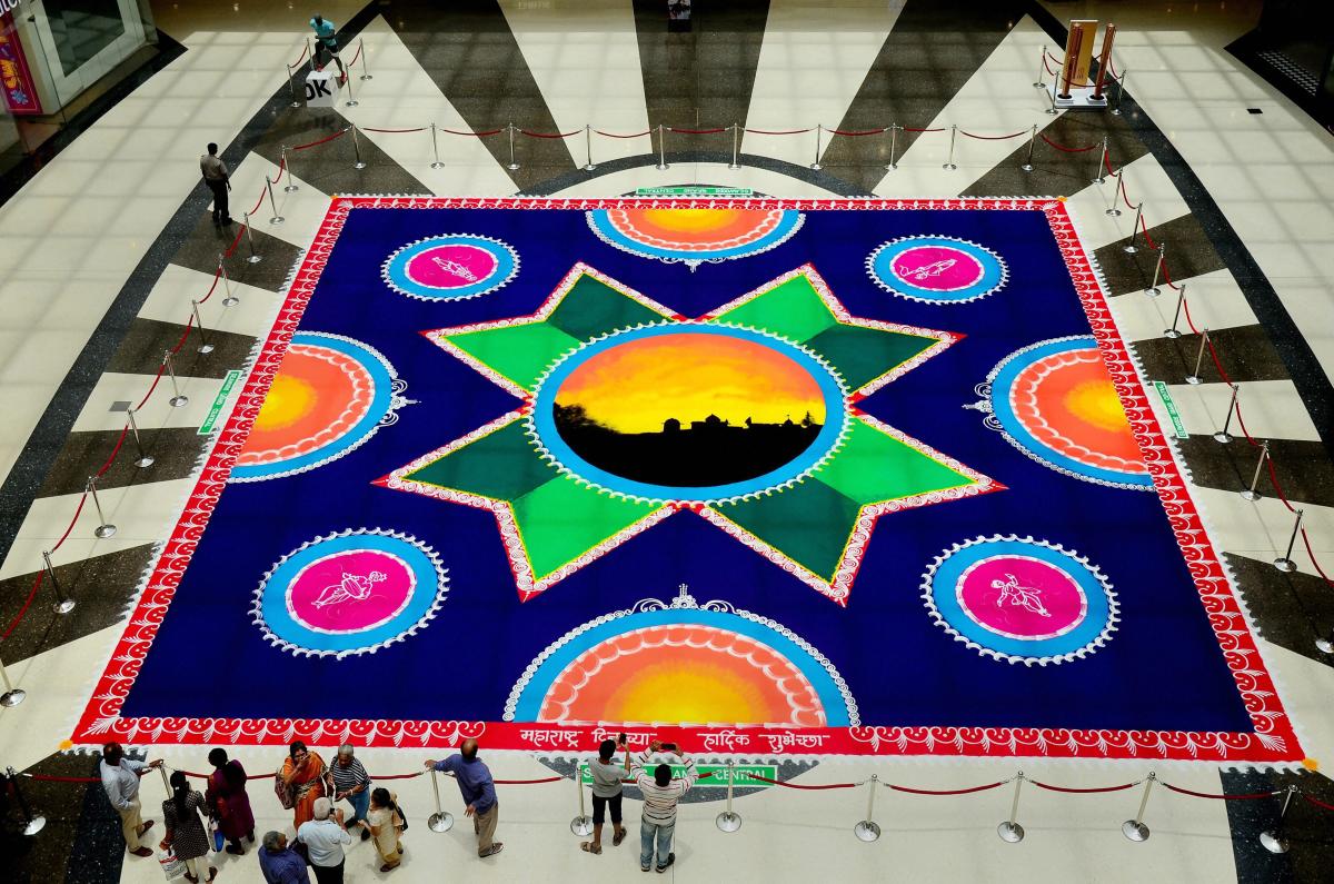 An 'eco-friendly' Rangoli, measuring 50x50 feet, created by Sanskar Bharthi to celebrate Maharashtra Day at Seawoods in Navi Mumbai on Tuesday. PTI Photo
