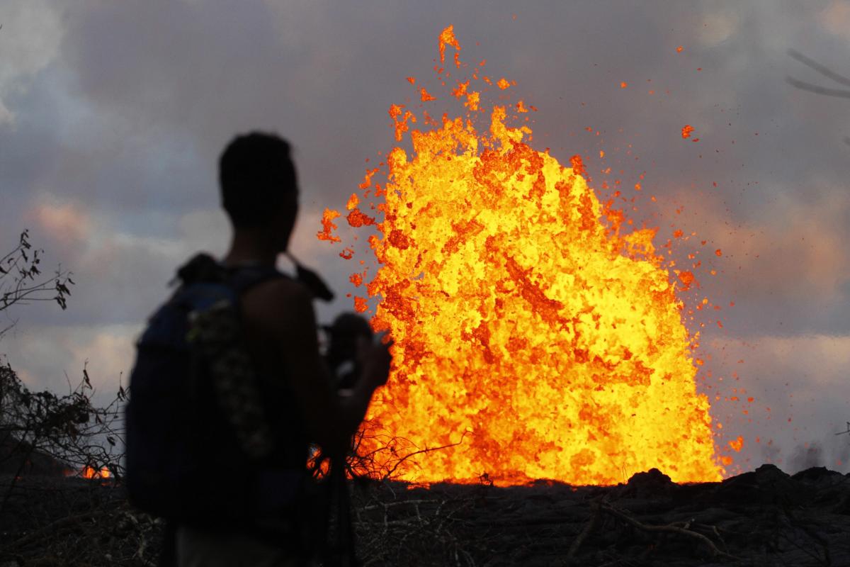 In this May 23, 2018 photo, lava erupts in the air in Leilani Estates area near Pahoa, Hawaii. The Kilauea volcano has opened more than 20 vents in the ground that have released lava, sulfur dioxide and steam. AP/PTI