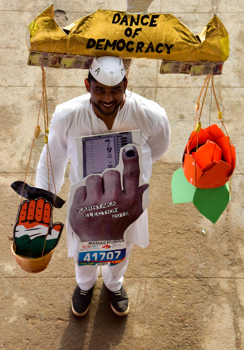 People participate with social slogans in TCS world 10 K run, at Sree Kanteerava Stadium, in Bengaluru on Sunday.DH Photo
