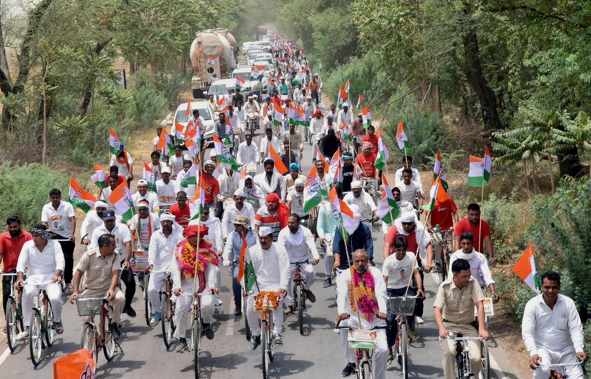 Sirsa: Congress leaders and party workers take part in 'Haryana Bachao Parivartan Lao' cycle yatra, in Sirsa, Haryana on Thursday, May 31, 2018. (PTI Photo)