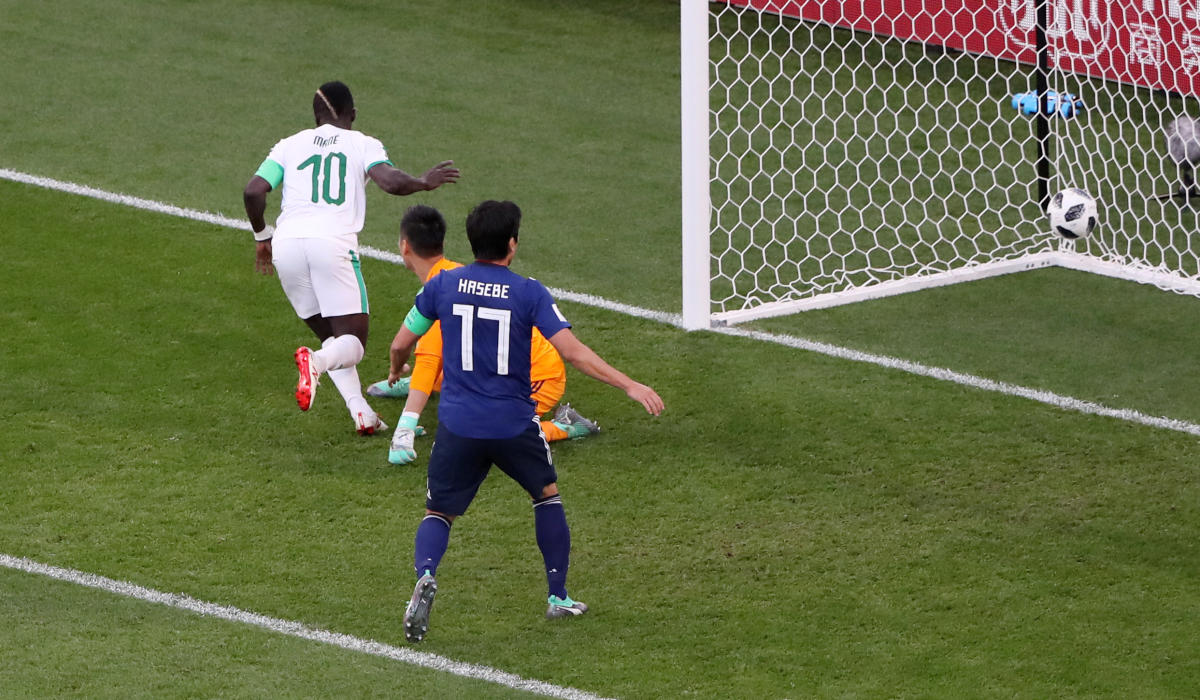 Soccer Football - World Cup - Group H - Japan vs Senegal - Ekaterinburg Arena, Yekaterinburg, Russia - June 24, 2018 Senegal's Sadio Mane scores their first goal past Japan's Eiji Kawashima REUTERS