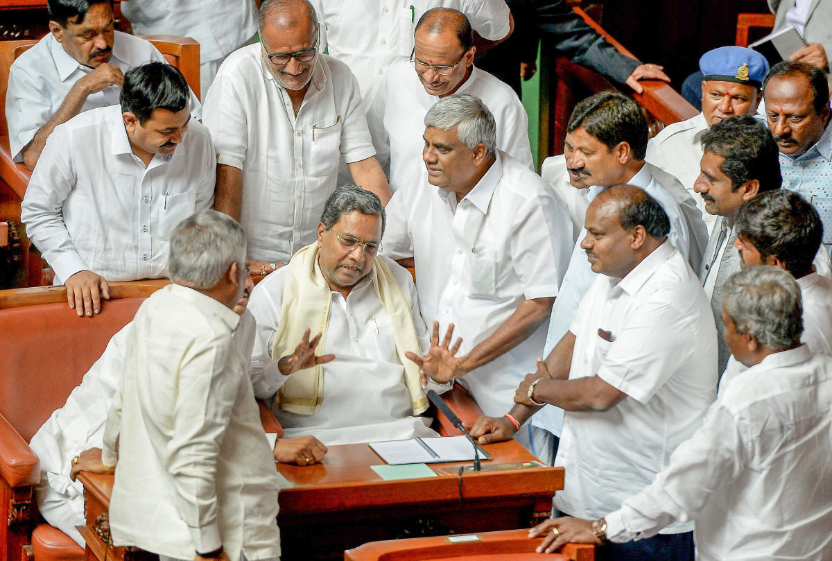 Karnataka Chief Minister H D Kumaraswamy, former chief minister Siddaramaiah and PWD minister H D Revanna with other assembly members during the Karnataka Assembly Joint Session at Vidhana Soudha, in Bengaluru on Monday, July 02, 2018. (PTI Photo)