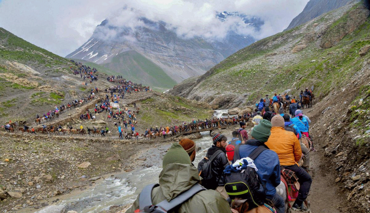 Pilgrims proceed towards the holy cave shrine of Amarnath, in Pahalgam on Friday, July 6, 2018. (PTI Photo)