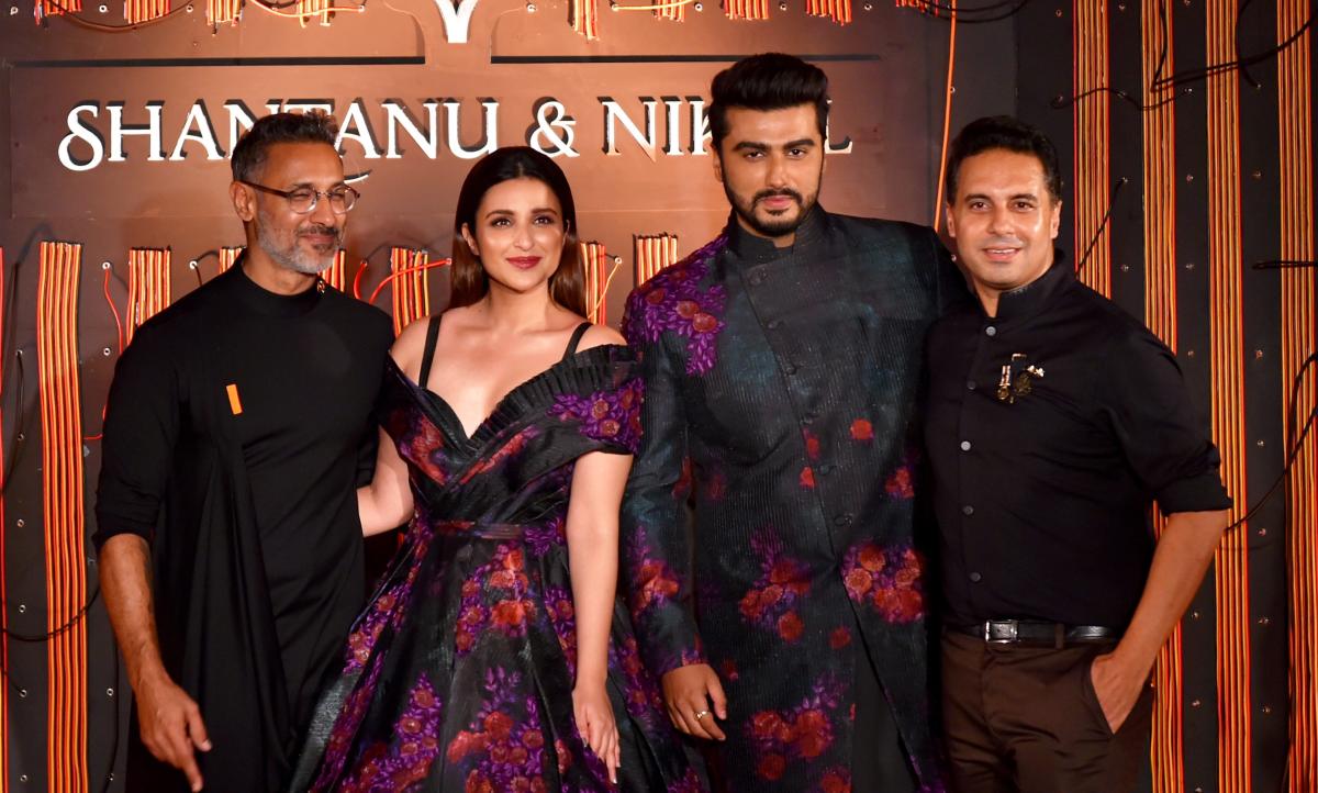 Parineeti Chopra and Arjun Kapoor with designers Nikhil and Shantanu during a fashion show in New Delhi. (PTI Photo)