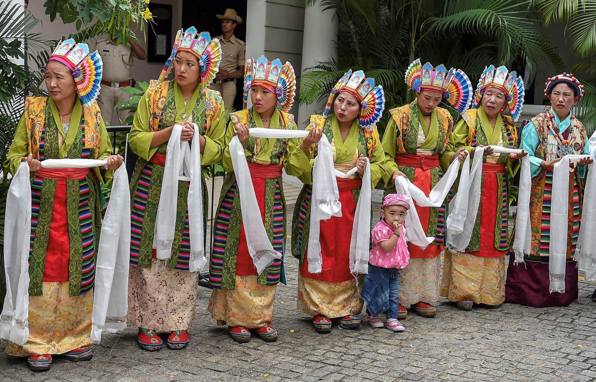 Tibetan women wait to welcome their spiritual leader the Dalai Lama for a programme in Bengaluru on Friday, Aug 10, 2010. The program, organized by the Tibetans living in Karnataka, is a part of the Thank You India - 2018 series of events commemorating 60 years of Tibetans-in-exile. (PTI Photo)