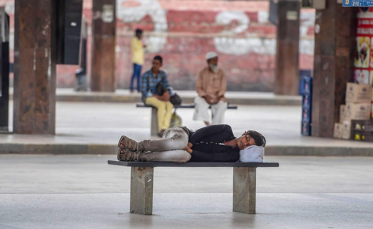 A commuter takes a nap at Majestic Bus Stand during 'Bharat Bandh' strike called by Congress and other parties against fuel price hike and depreciation of the rupee, in Bengaluru, Monday, Sept 10, 2018. PTI Photo