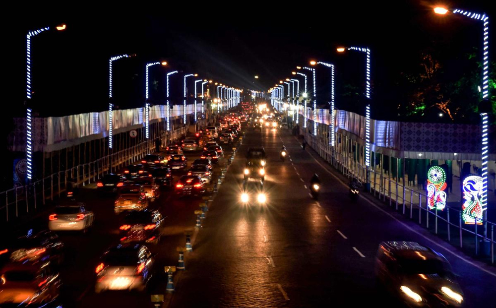 A view of Indira Gandhi Sarani on the eve of puja carnival in Kolkata, Monday. Idols of 72 award winning pandals will be showcased in one place as a parade through Red Road with culminate in a grand immersion. PTI Photo
