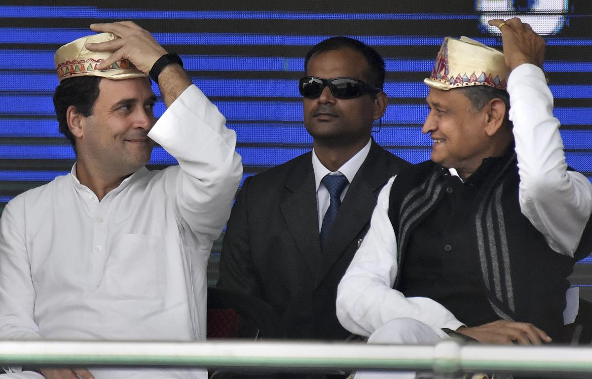 Patna: Congress President Rahul Gandhi and Rajasthan Chief Minister Ashok Gehlot share a light moment during 'Jan Akanksha Rally', at Gandhi Maidan in Patna, Sunday, Feb. 03, 2019. (PTI Photo)