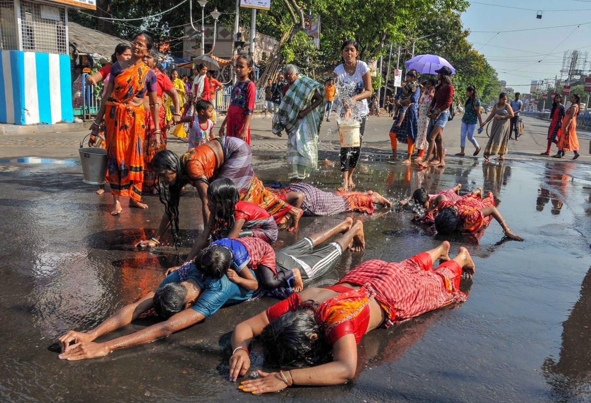 Devotees perform 'Dandi' rituals during 'Goddess Shitala Puja', in Kolkata, Saturday, April 20, 2019. (PTI Photo)