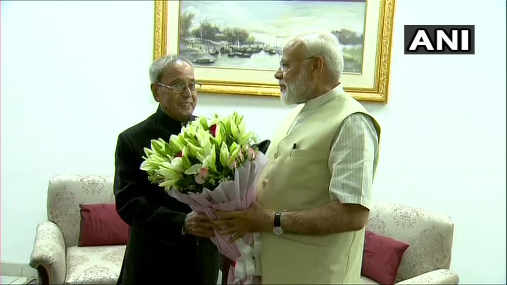 Prime Minister Narendra Modi meets the former President Pranab Mukherjee at his residence in New Delhi. PTI Photo