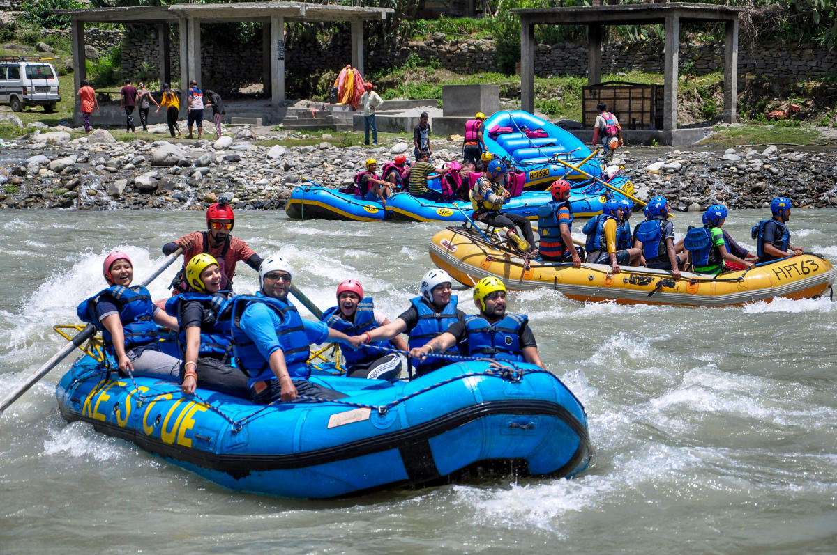 Tourists during a rafting trip on River Beas during the summer season, in Kullu, Himachal Pradesh. (PTI Photo)