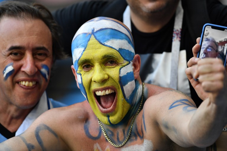 A Uruguay fan cheers before the Russia 2018 World Cup Group A football match between Uruguay and Russia at the Samara Arena in Samara on June 25, 2018. Source: Fabrice COFFRINI / AFP