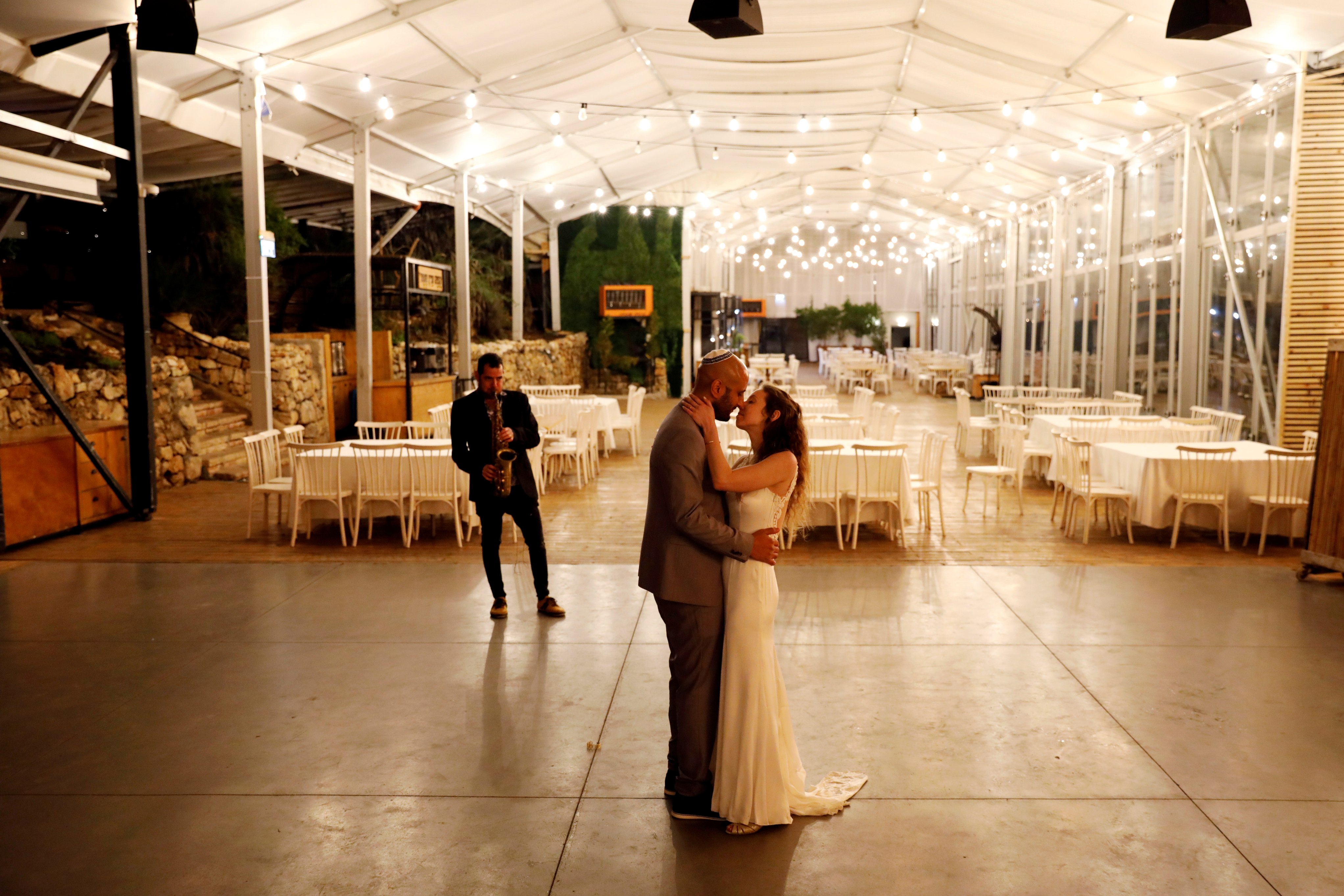 Israeli couple Roni Ben-Ari and Yonatan Meushar, dance as they get married at Ein Hemed Forest Wedding Venue in Israel. (Credit: Reuters)