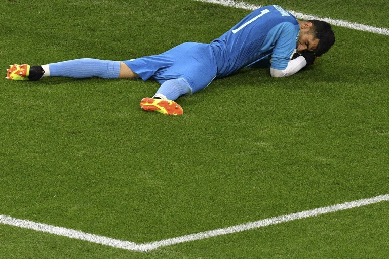 Iran's goalkeeper Alireza Beiranvand saves Portugal's forward Cristiano Ronaldo's penalty during the Russia 2018 World Cup Group B football match between Iran and Portugal at the Mordovia Arena in Saransk on June 25, 2018. Source: Mladen ANTONOV / AFP