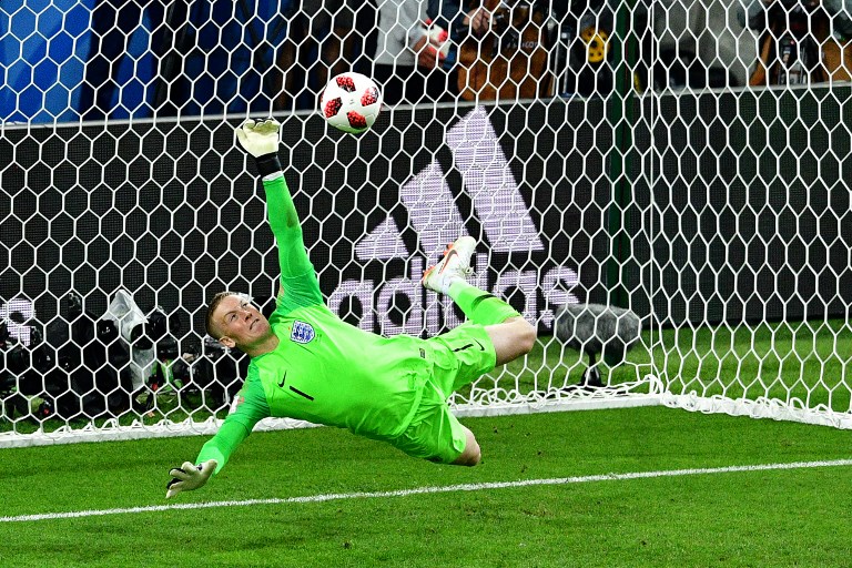 England's goalkeeper Jordan Pickford saves a penalty kicked by Colombia's forward Carlos Bacca during the penalty shootouts during the Russia 2018 World Cup round of 16 football match between Colombia and England at the Spartak Stadium in Moscow on July 3, 2018.  Mladen ANTONOV / AFP