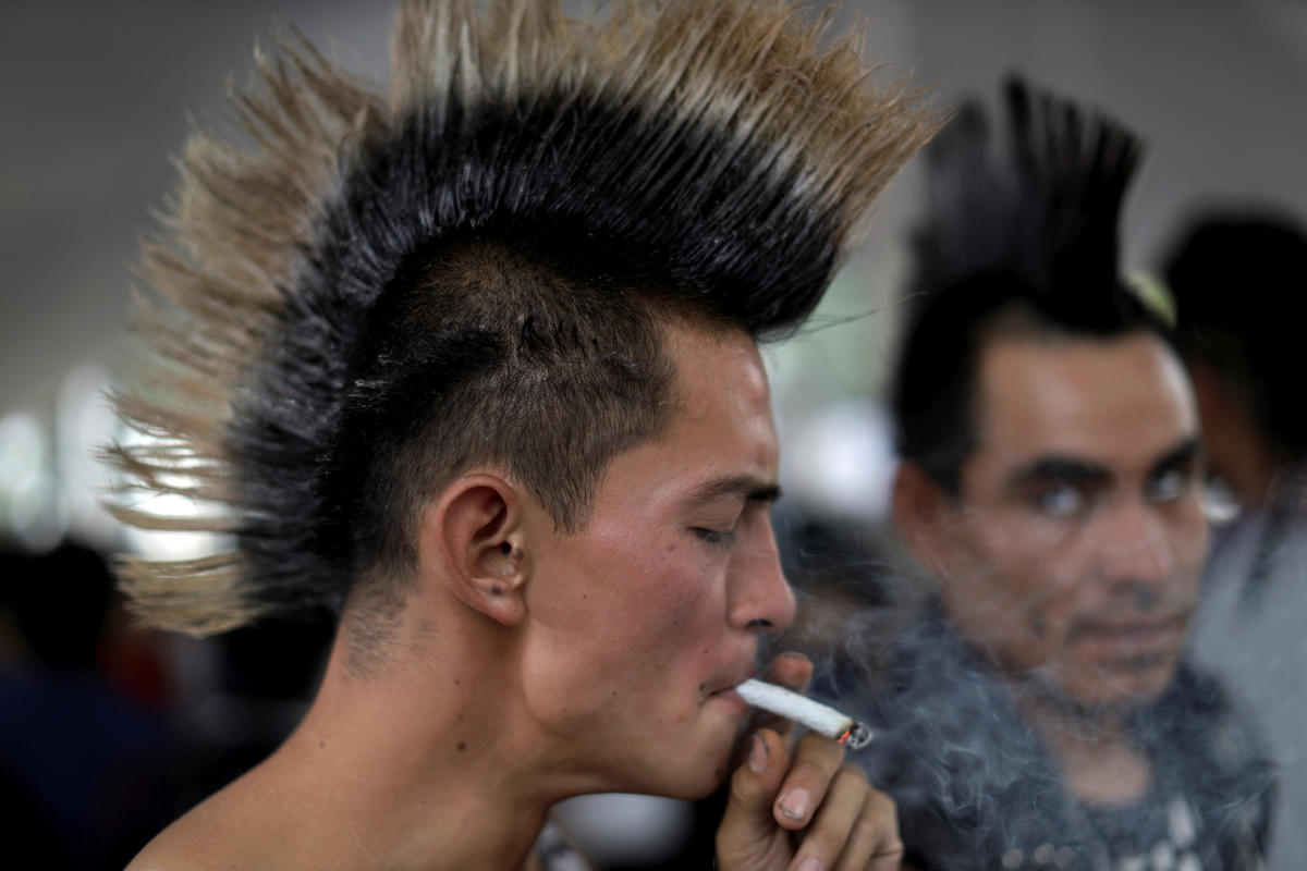 A man smokes a marijuana joint during a protest to demand legalization in Mexico City, Mexico April 24, 2019. REUTERS/Luis Cortes