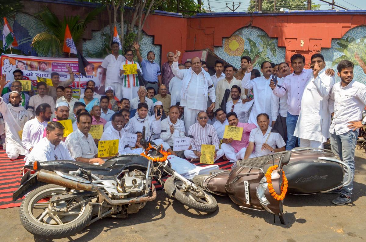 Congress workers protest against the fuel price hike in Meerut on Saturday. PTI Photo