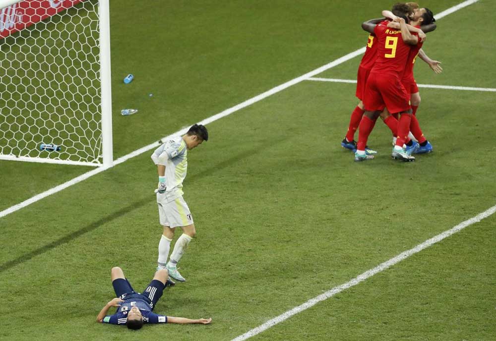 Belgium's Nacer Chadli, top right, is cheered by teammates after scoring his third side goal during the round of 16 match between Belgium and Japan at the 2018 soccer World Cup. AP/PTI Photo