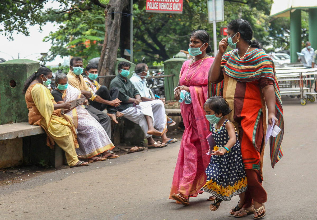 People wear safety masks as a precautionary measure after the 'Nipah' virus outbreak, at Kozhikode Medical College, in Kerala, on Friday. PTI Photo