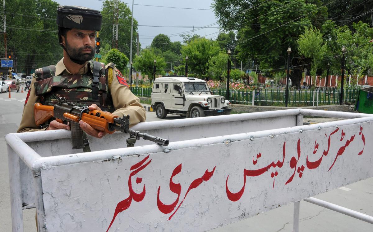 A security personnel stands guard, ahead of Prime Minister Narendra Modi's visit, near the program venue in Srinagar, on Friday. PTI Photo