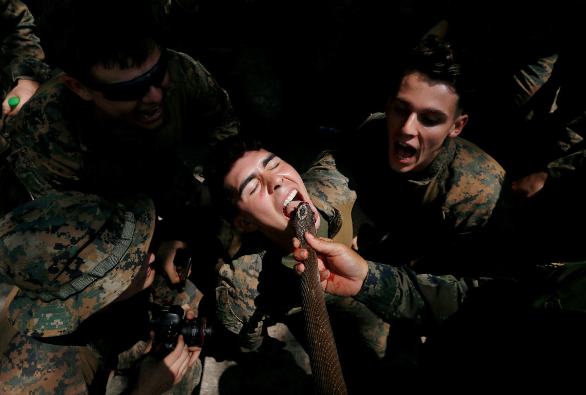 A U.S. Marine is fed snake blood during the Cobra Gold multilateral military exercise in Chonburi, Thailand March 4, 2020. REUTERS/Soe Zeya Tun
