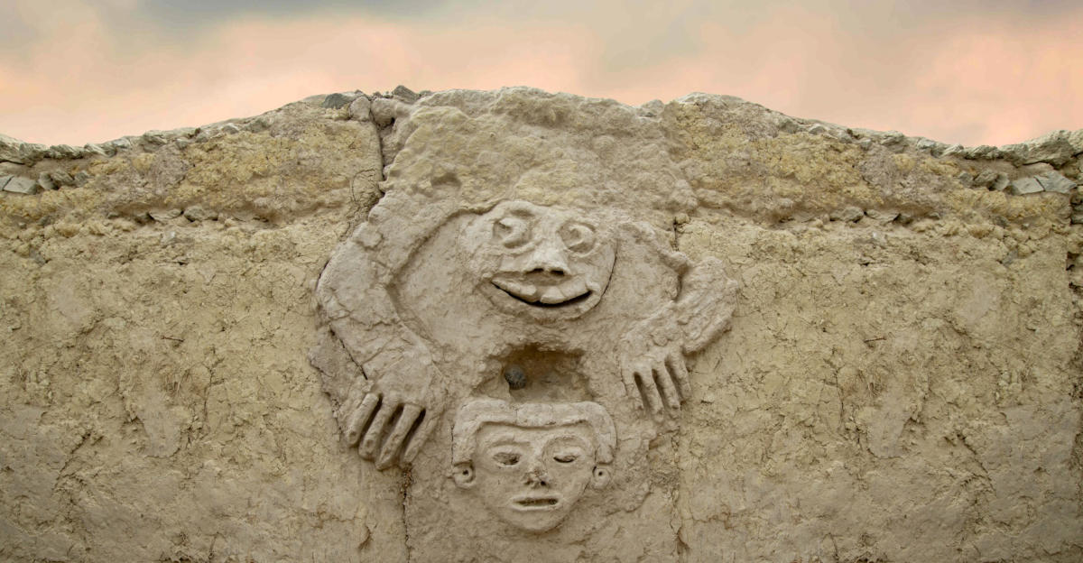 A wall decorated in high relief with the figure of a humanized toad from 3,800 years ago at Vichama archaeological site, in Vegueta district, Huaura province, Peru. (Photo: AFP)