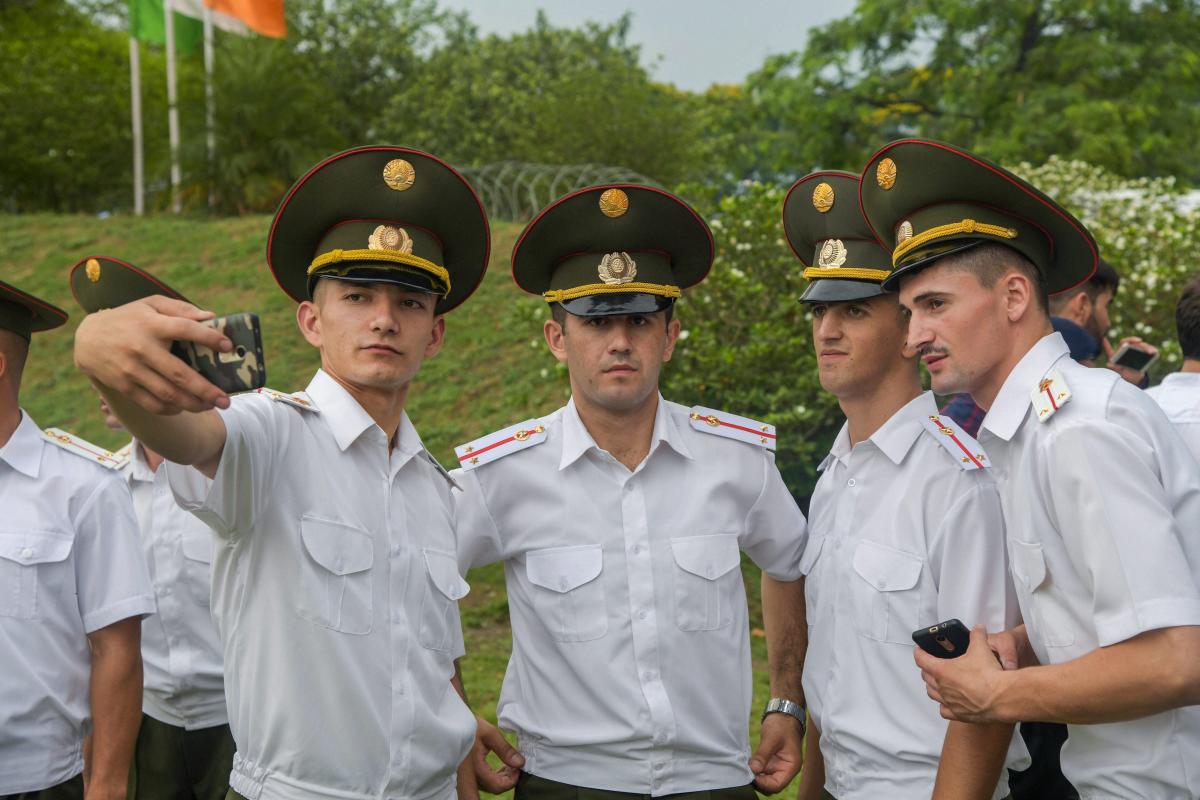 Newly graduated foreign officers take selfie after the passing out parade at Indian Military Academy in Dehradun on Saturday. PTI Photo