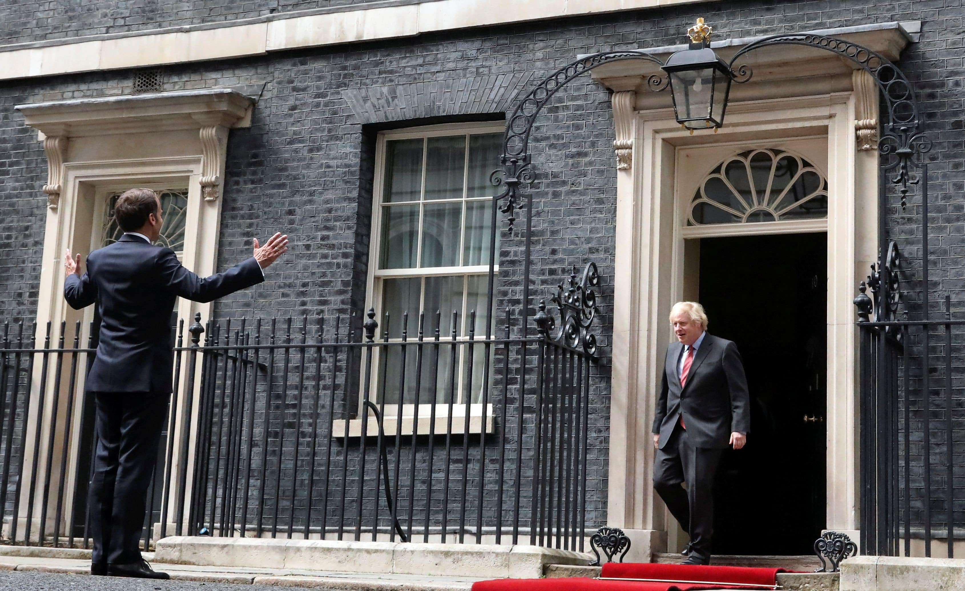 French President Emmanuel Macron gestures as he meets Britain's Prime Minister Boris Johnson at Downing Street in London, Britain. Credit: Reuters Photo