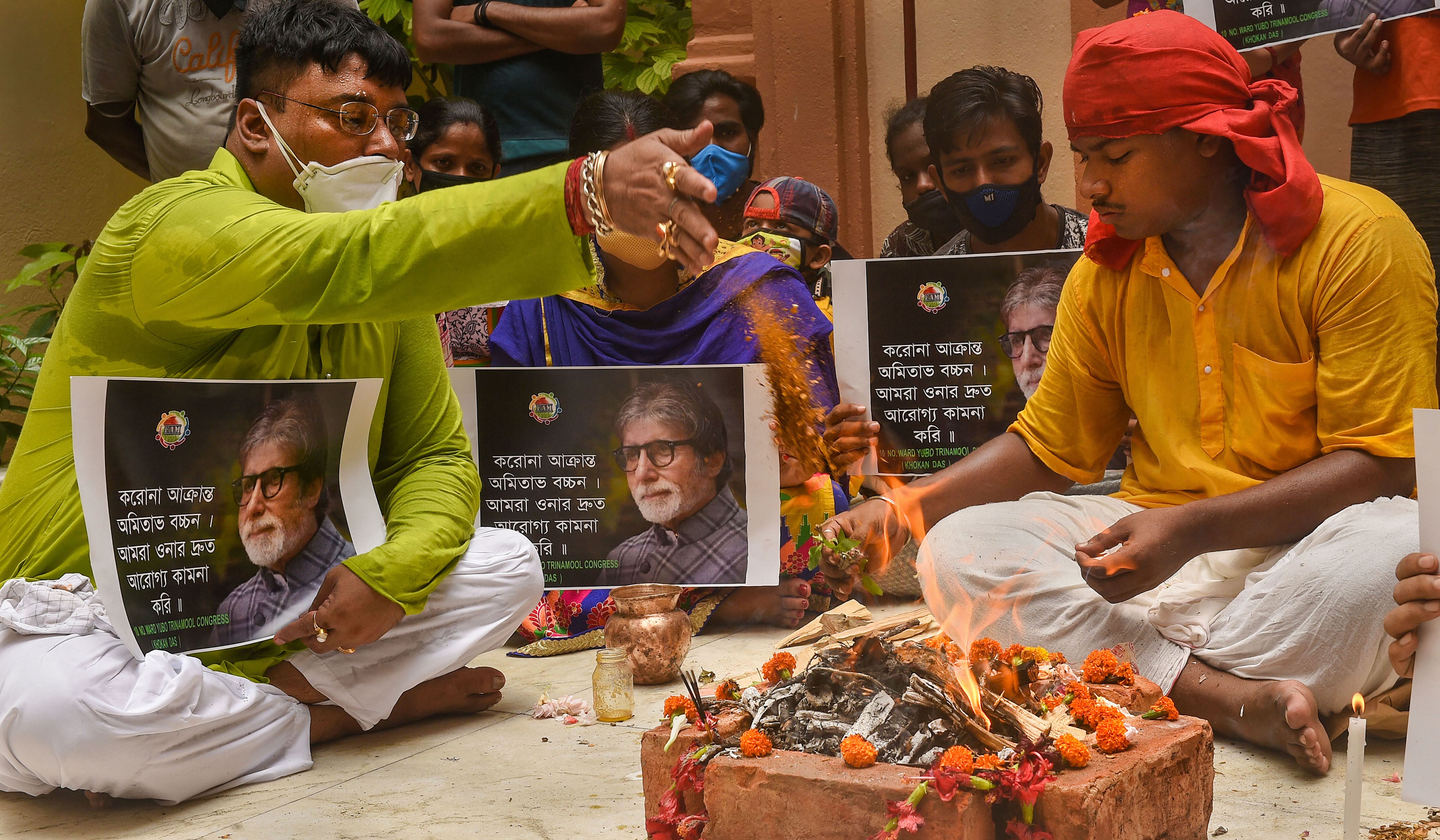 Fans of Bollywood mega star Amitabh Bachchan perform a 'havan' for his speedy recovery from Covid-19, in Kolkata. Credits: PTI Photo