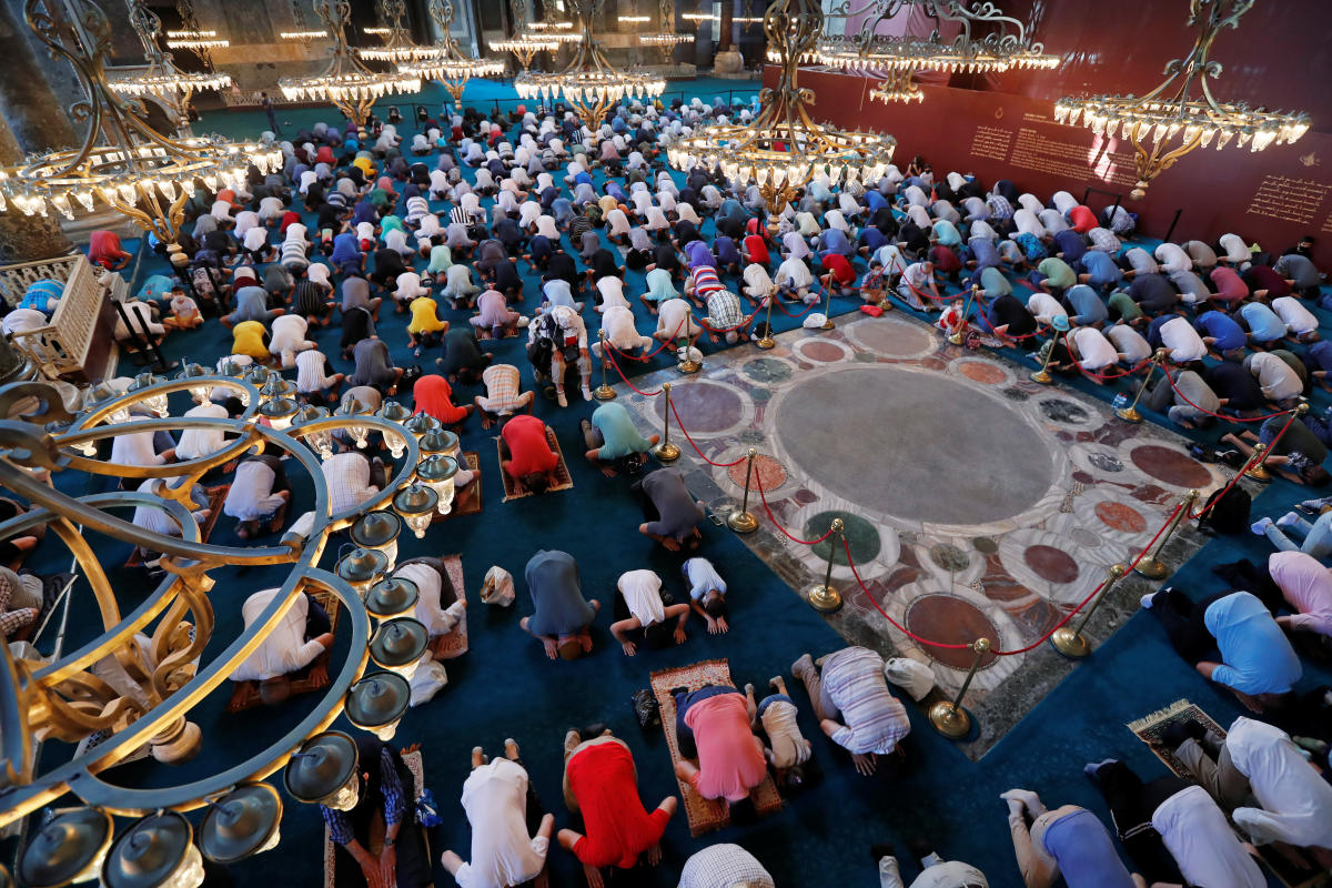 Worshippers attend the afternoon prayer at Hagia Sophia Grand Mosque in Istanbul, Turkey. Credit: Reuters Photo