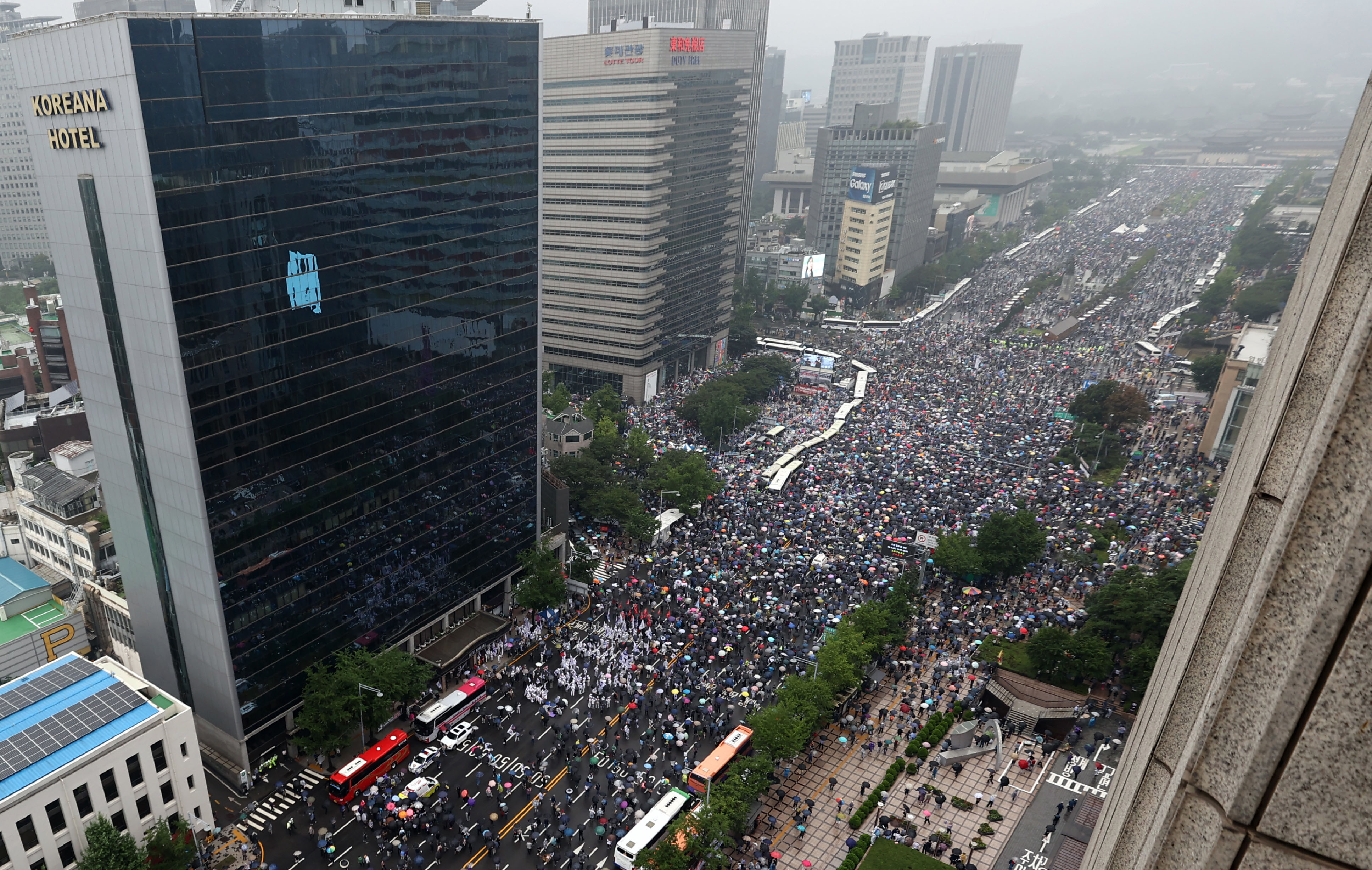 Protesters gather to hold a rally against the government in Seoul, South Korea, Saturday, Aug. 15, 2020. Thousands of anti-government protesters, armed with umbrellas and raincoats, marched through the soggy streets of South Korea's capital Saturday, ignoring official pleas to stay home amid a surge in coronavirus infections. Credit: AP Photo