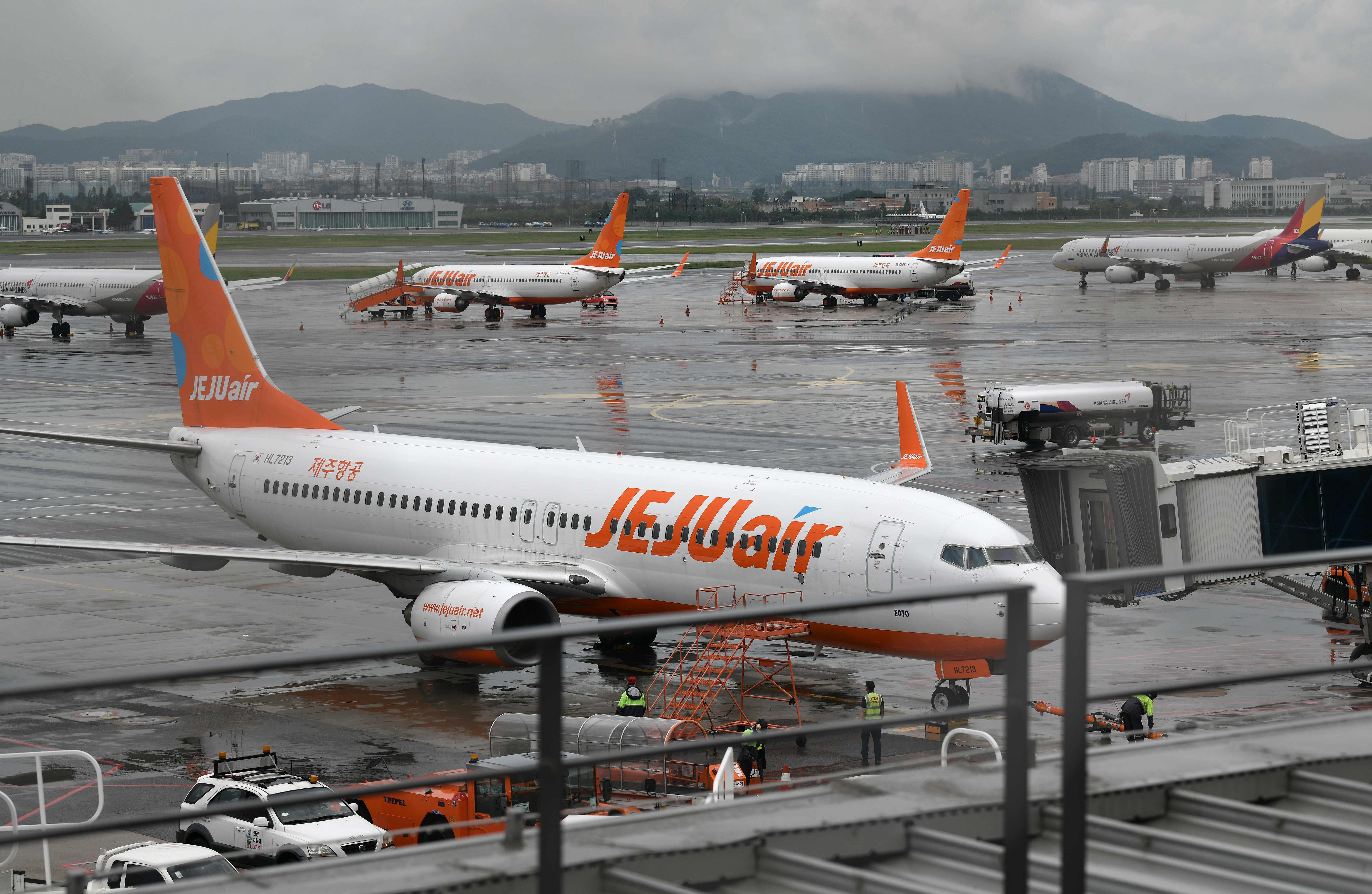 Airplanes are parked on the tarmac ahead of the arrival of Typhoon Maysak at Gimpo domestic airport in Seoul. Credit: AFP Photo