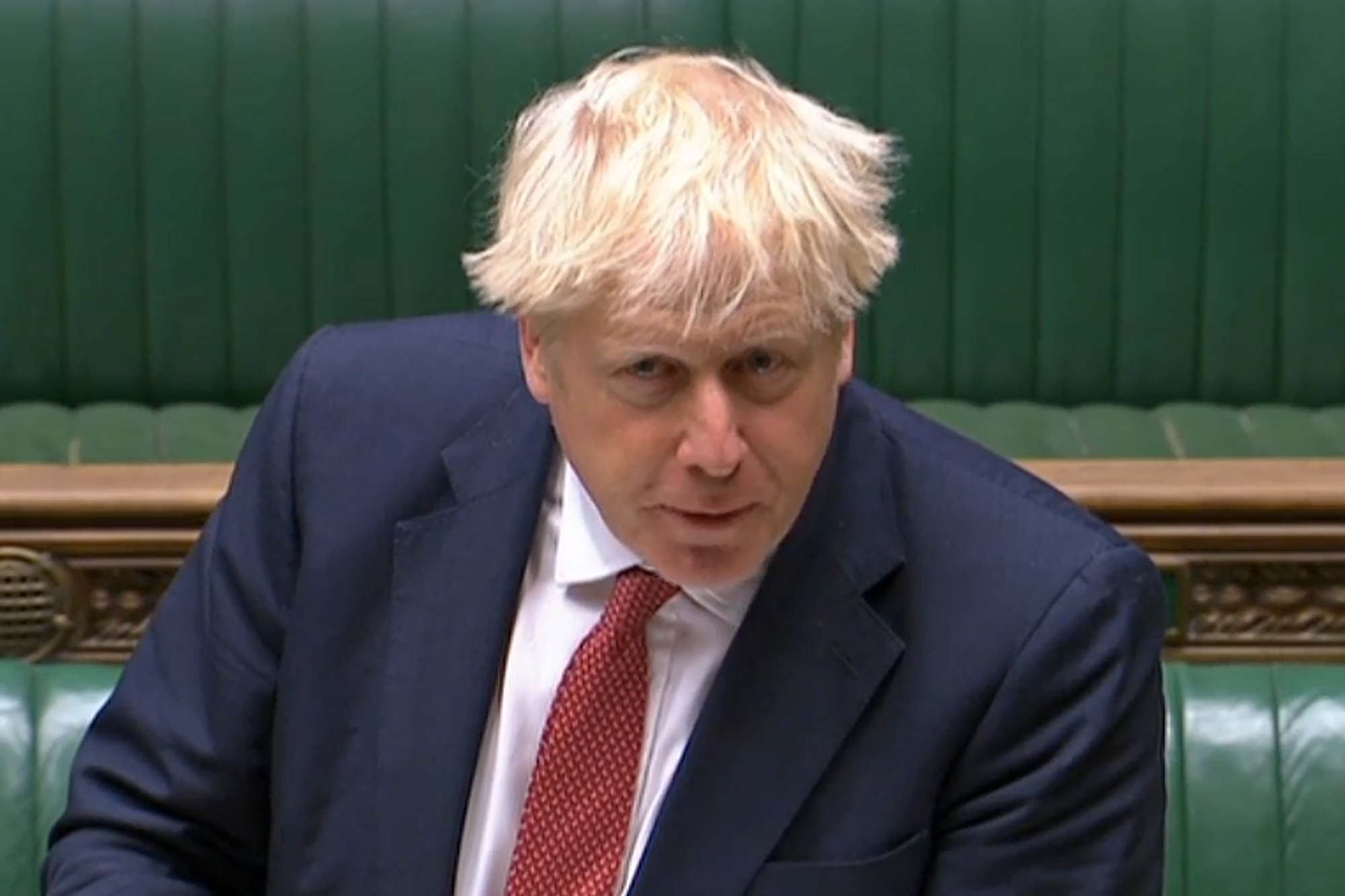 A video grab from footage broadcast by the UK Parliament's Parliamentary Recording Unit (PRU) shows Britain's Prime Minister Boris Johnson speaking during Prime Minister's Question time (PMQs) in the House of Commons in London. Credit: AFP Photo