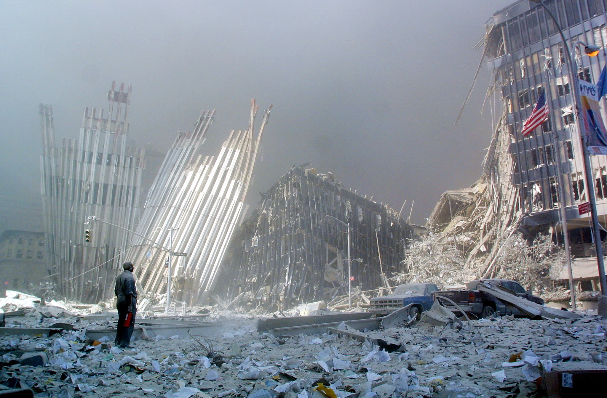 A man stands in the rubble, and calls out asking if anyone needs help, after the collapse of the first World Trade Center Tower in New York. Credit: AFP Photo