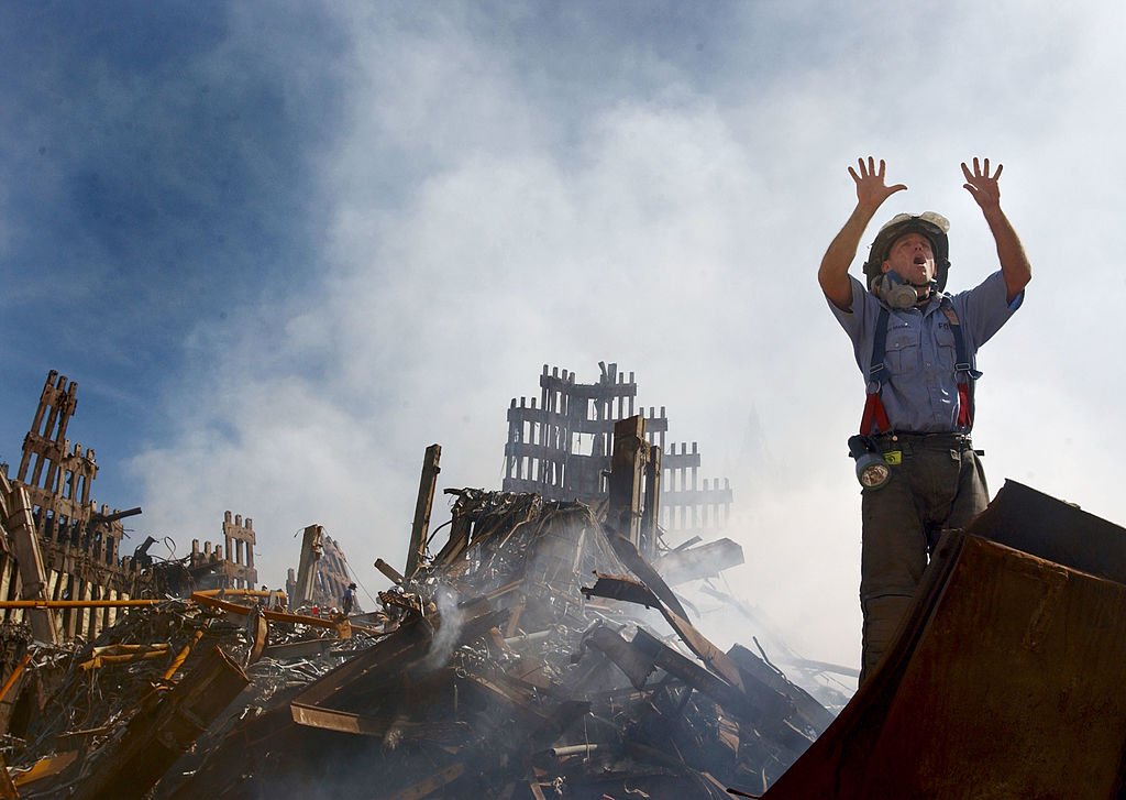 A New York City fireman calls for 10 more rescue workers to make their way into the rubble of the World Trade Center September 14, 2001 days after the September 11, 2001 terrorist attack. Credit: Getty Images